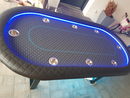 black blue led light poker table with cup holders background 
hearts, spades, clubs and diamonds