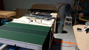 working on a poker field laying on a wooden plank
