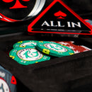 Poker chips and cards with a 'All In' sign on a black surface